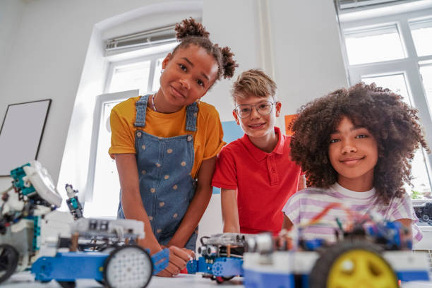 istock Happy kids programming electric toys . 1403998001