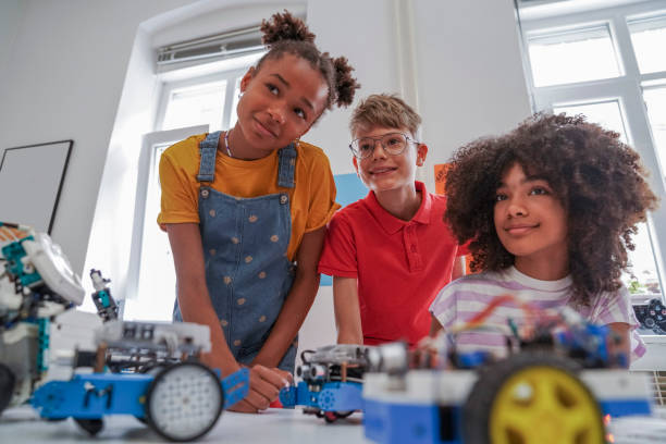istock Happy kids programming electric toys . 1403998025