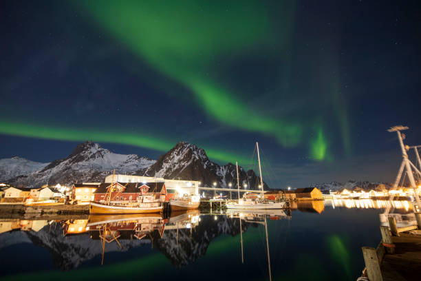 Svolvaer by dusk in Vagan Nordland Lofoten arcipelago  North of Norway . Svolvaer with the Northern lights  in Austvagoya island Vagan Nordland Lofoten archipelago  North of Norway . View from the island of Lamholmen, in the middle of Svolvær Harbour. harbor of svolvaer in winter lofoten islands norway stock pictures, royalty-free photos & images