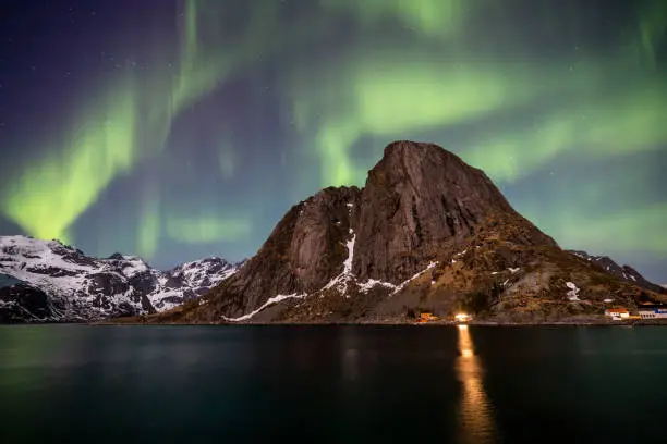 Beautiful green Aurora Northern lights over Hamnoy Reine in the Lofoten islands, Moskenes  Nordland Norway