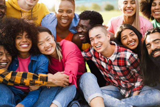 istock Young diverse people having fun outdoor laughing together - Diversity concept - Main focus on bald girl face 1403998517