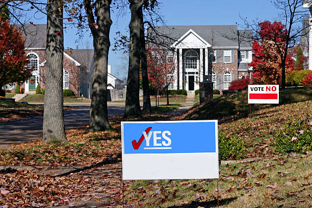 Neighborhood with election signs. These are yes and no that have been cleaned up for your own text. Shows opposition.