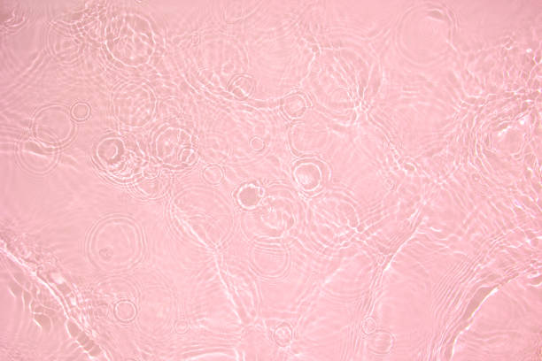 istock transparent pink colored clear calm water surface texture 1403999411