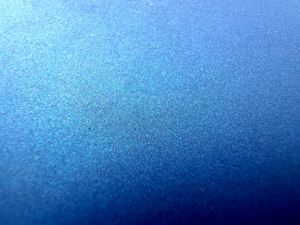 A macro image of a very fine, matte and blue plastic. stock photo