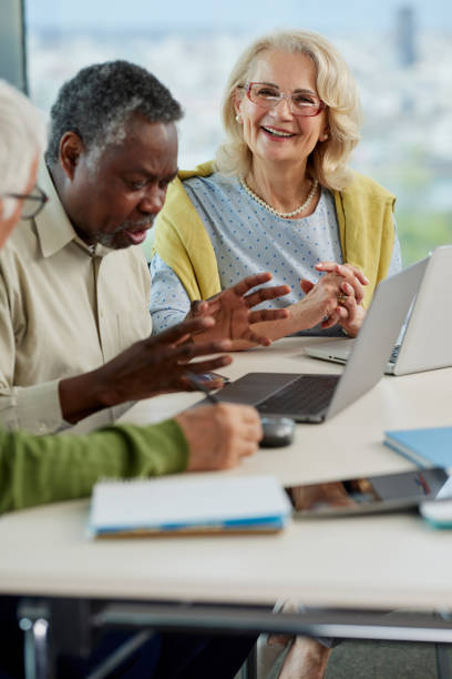 istock A small group of multicultural senior students sit in the classroom and working on school project. 1403999605