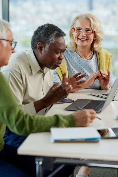 istock A small group of multicultural senior students sit in the classroom and working on school project. 1403999629