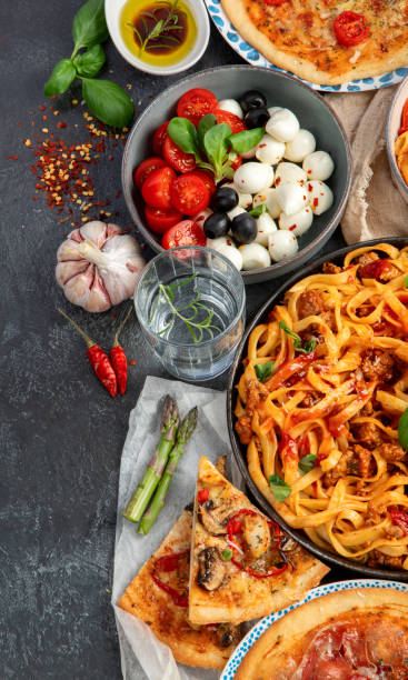 istock Italian food assortment on dark background. 1404000124