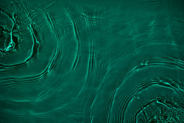 istock transparent dark green clear calm water wave surface texture 1404000169