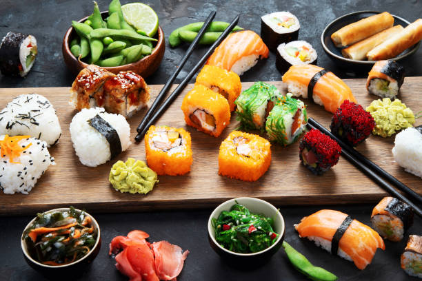 Japanese food assortment on dark background. stock photo