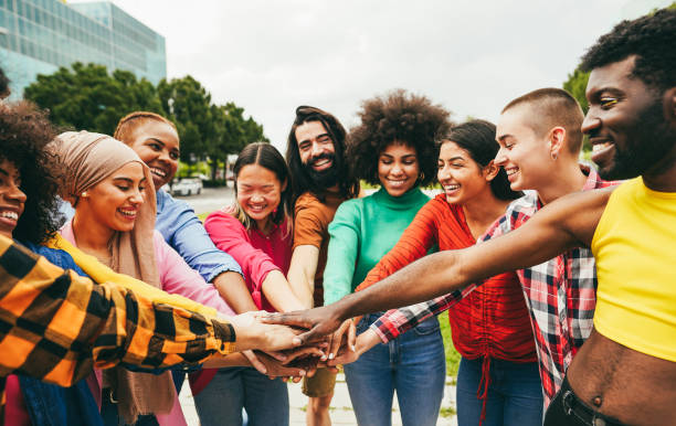 istock Young multiethnic people having fun stacking hands outdoor - Focus on hands 1404003438
