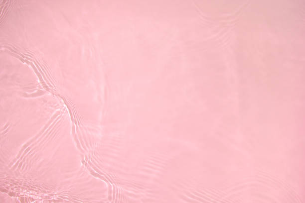 istock transparent pink colored clear calm water surface texture 1404004134
