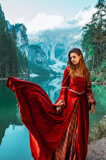 A beautiful brunette princess at a picturesque lake setting in Northern Italy