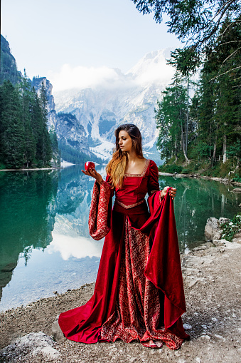 A beautiful brunette princess at a picturesque lake setting in Northern Italy