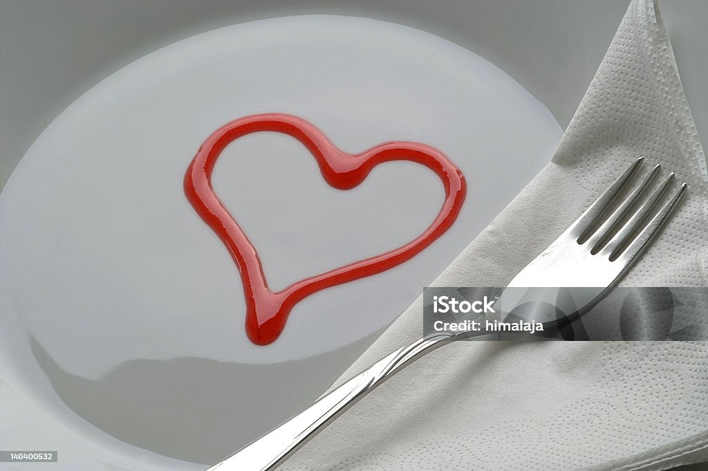 Served with love Simple cover, made out of a heart shape on a plate. Affectionate Stock Photo
