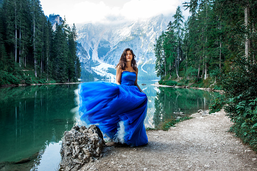 A beautiful brunette princess at a picturesque lake setting in Northern Italy