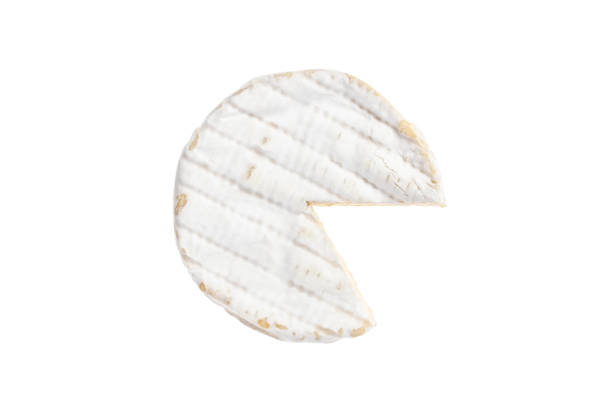 White round soft brie cheese. Sliced camembert isolated on white background, top view. Dairy product. stock photo