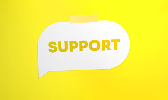 Support Written White Speech Bubble On Yellow Background. Communication Concept.