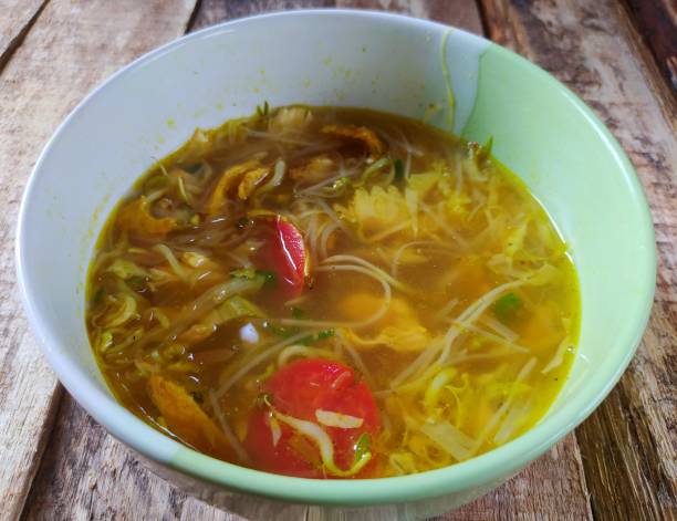 istock Soto kudus. Authentic clear chicken soup from Kudus on a wooden background, Central Java, Indonesia 1404005923