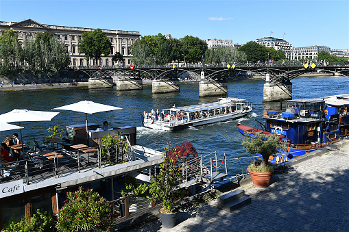 Paris, France-06 12 2022: Boat on Seine river in Paris, France.