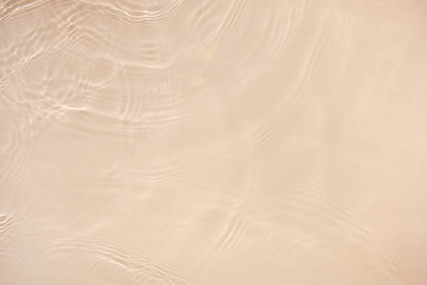 istock transparent beige colored clear calm water surface texture 1404007284