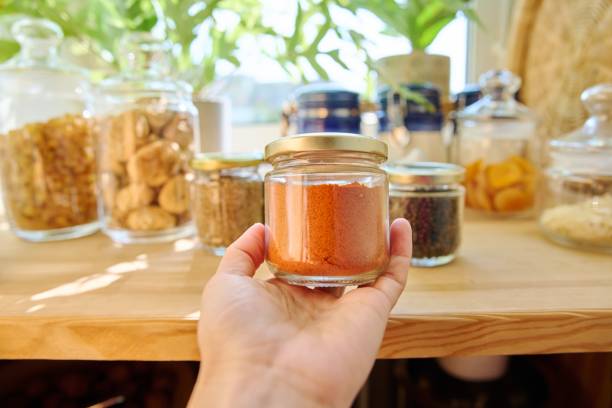 istock Jars with different spices in the kitchen, paprika close-up 1404007414
