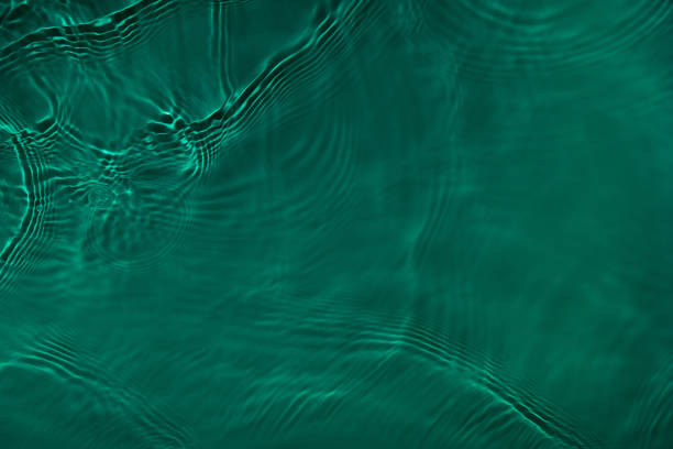 istock transparent dark green clear calm water wave surface texture 1404007562