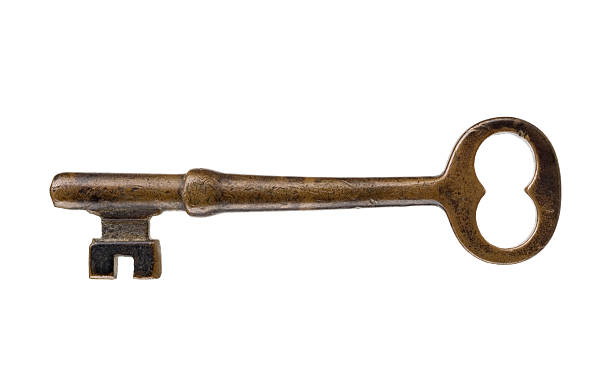 Antique key on white background stock photo
