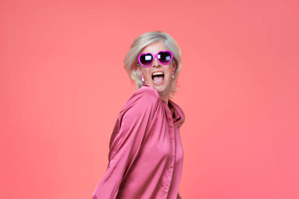 Beautiful woman in a historic costume illuminated by neon colors, reflecting a mix of retro elegance and modern vibrancy.