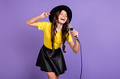 Photo of nice optimistic brunette hairdo girl sing wear cap t-shirt skirt isolated on lilac background