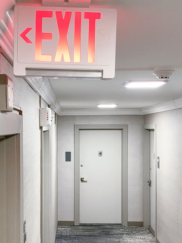 Exit sign in a corridor of a residential building