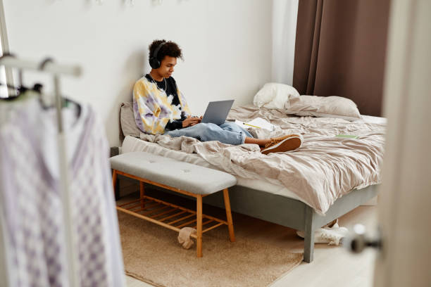 istock Teenage Boy in Bedroom 1404010758