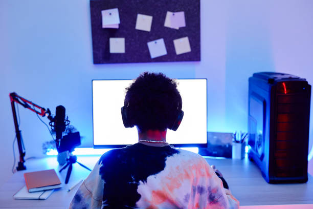 istock Teen Boy Gaming Back View 1404010786