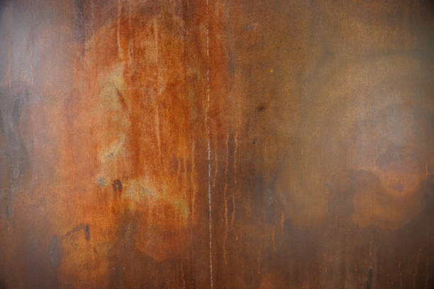 istock rust steel plate background and texture. abstract art rusty wall with dark vignette. 1404011502