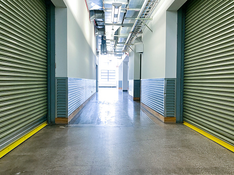 Storage warehouse corridor with closed shutters