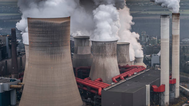 istock Aerial view of steaming cooling towers 1404016228