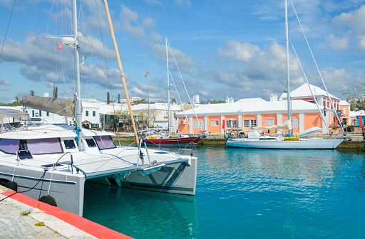 Three yachts, visitors from the United States,  are docked near King's Square in St. George, Bermuda on a bright May morning.