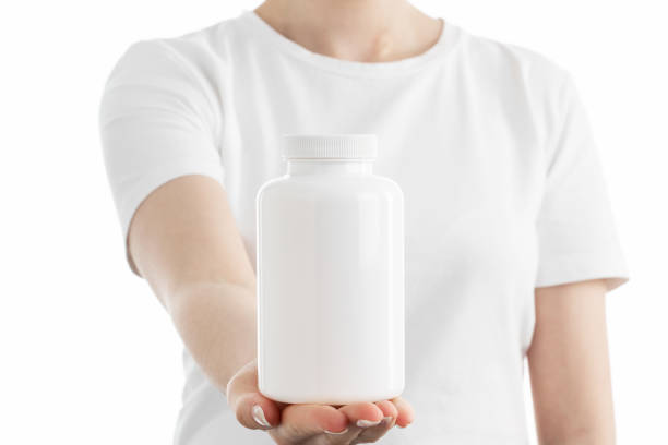 istock Close up image of woman holding a white bottle 1404018357