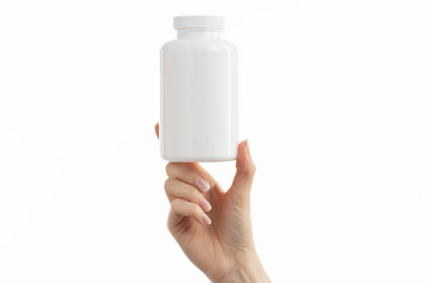 istock Close up image of woman holding a white bottle 1404018908