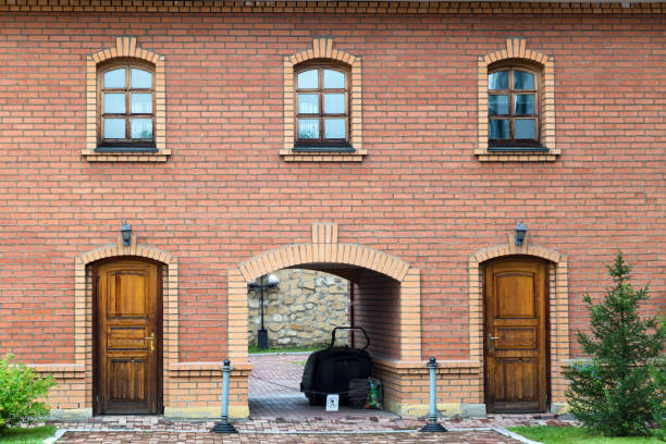 istock Brick building with an arch, two entrances and three windows 1404019304