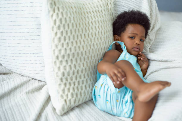 istock Toddler relaxing in the couch 1404020874