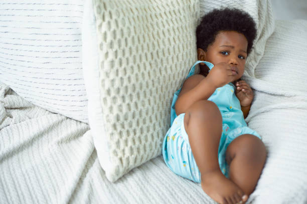 istock Toddler relaxing in the couch 1404020875