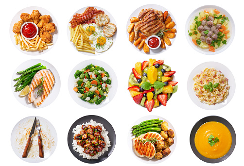 set of various plates of food isolated on a white background, top view