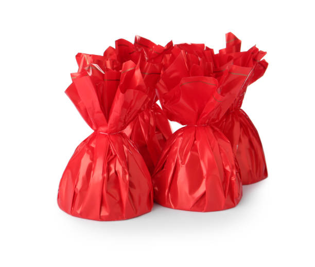 istock Delicious candies in red wrappers on white background 1404022863