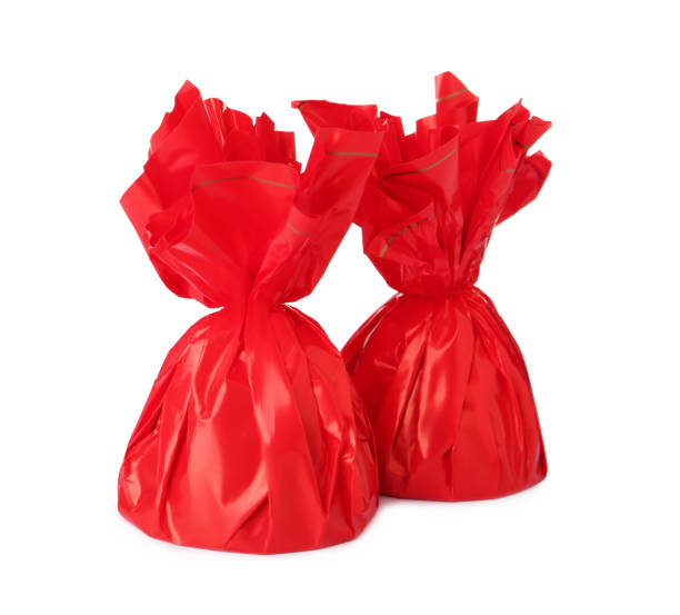 istock Delicious candies in red wrappers on white background 1404022865