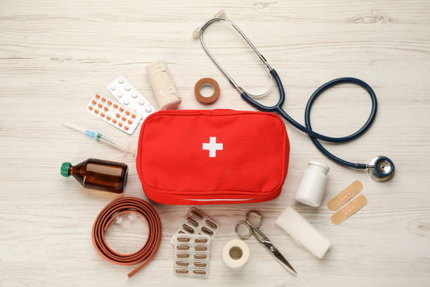 istock First aid kit on white wooden table, flat lay 1404023067