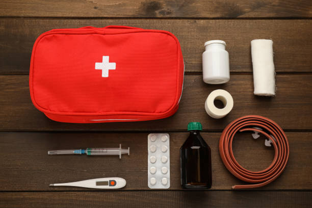 istock First aid kit on wooden table, flat lay 1404023069