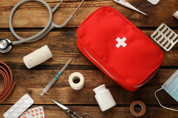 istock First aid kit on wooden table, flat lay 1404023211