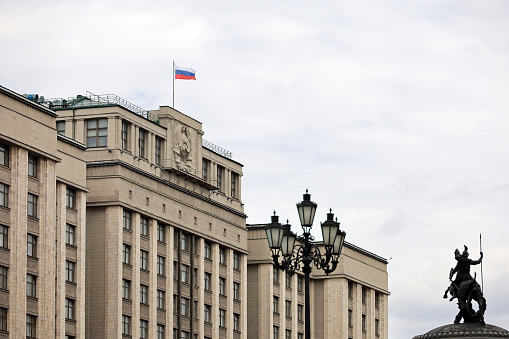 Facade of State Duma of Russia and and the monument to St. George at the Manege square