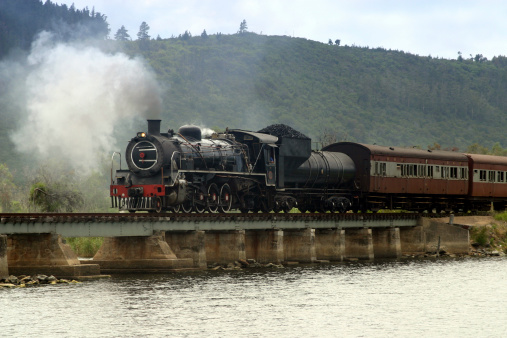 The Outeniqua Chootjoe steam train crossing the bridge at Swart Vlei just outside Sedefield.