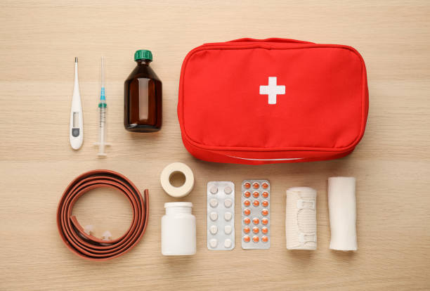 istock First aid kit on light wooden table, flat lay 1404023704
